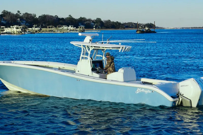  Yacht Photos Pics 2007 Yellowfin 36 Offshore boat on calm blue water, featuring Mercury engines.