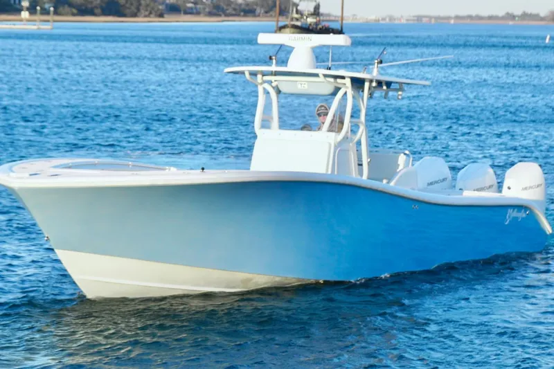  Yacht Photos Pics 2007 Yellowfin 36 Offshore boat cruising on blue water.