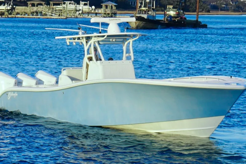  Yacht Photos Pics 2007 Yellowfin 36 Offshore boat cruising on blue water.