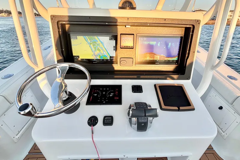  Yacht Photos Pics Control panel of a 2007 Yellowfin 36 Offshore boat with navigation screens.