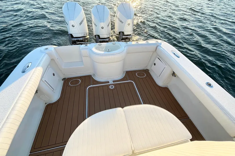  Yacht Photos Pics 2007 Yellowfin 36 Offshore boat with triple Mercury engines on the water.