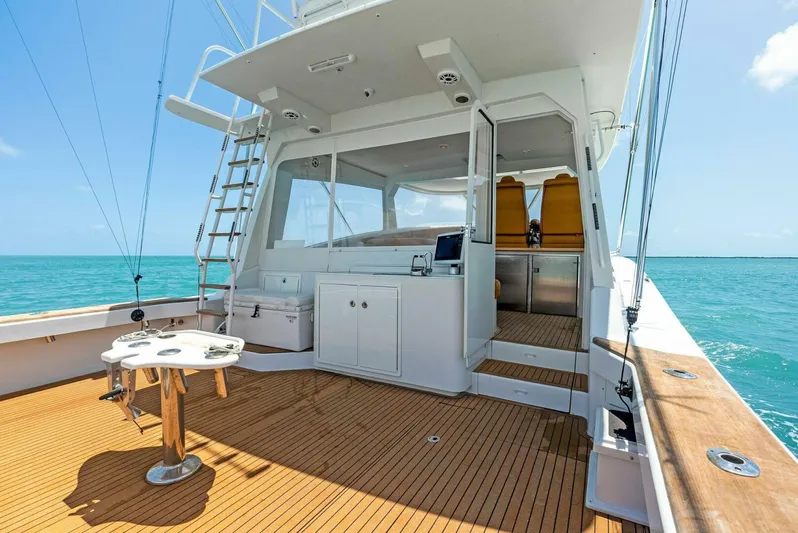  Yacht Photos Pics 2020 Calcutta 480 Catamaran deck with ocean view, teak flooring, and fishing table.