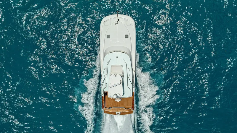  Yacht Photos Pics Aerial view of 2020 Calcutta 480 Catamaran cruising on blue ocean waters.