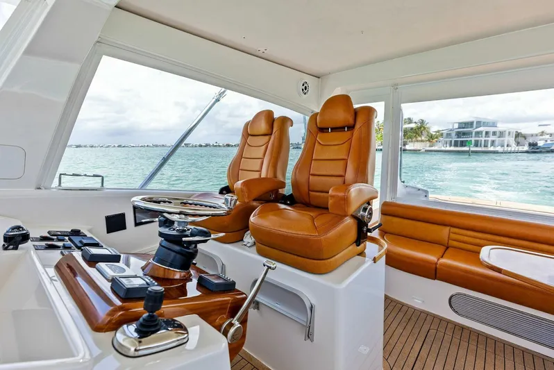  Yacht Photos Pics Interior of 2020 Calcutta 480 Catamaran with leather seats and modern controls.