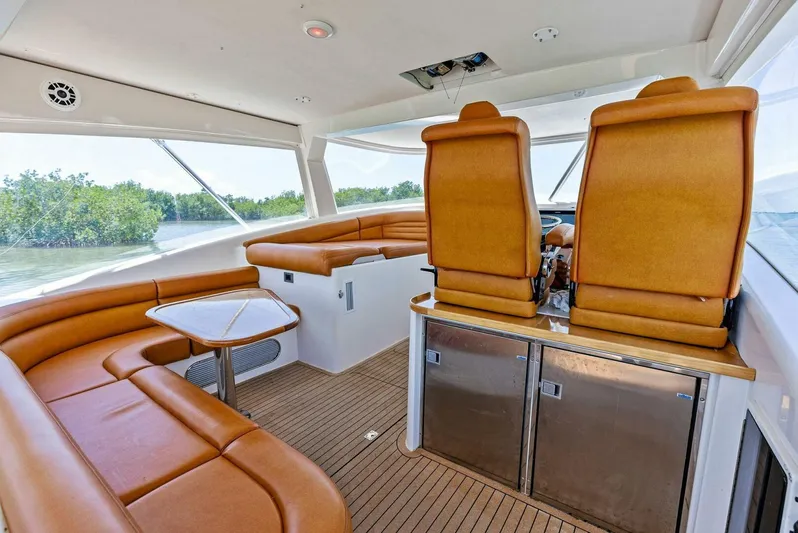  Yacht Photos Pics Interior of 2020 Calcutta 480 Catamaran with leather seating and modern helm.