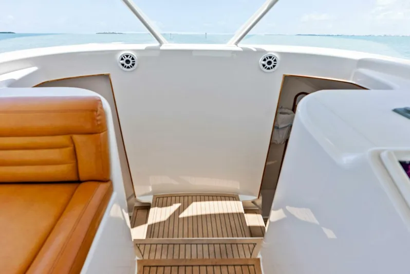  Yacht Photos Pics Interior view of 2020 Calcutta 480 Catamaran with teak flooring and leather seating.