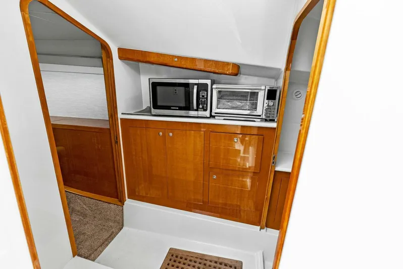  Yacht Photos Pics 2020 Calcutta 480 Catamaran interior kitchen with microwave and toaster oven.