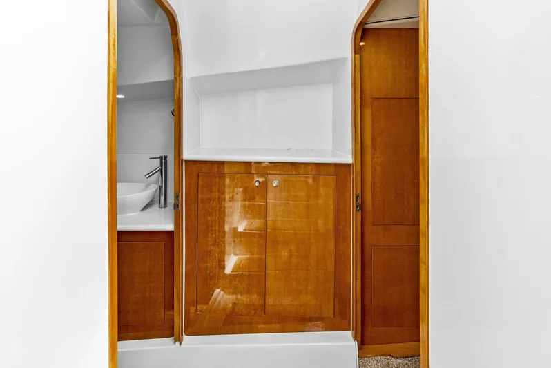 Yacht Photos Pics Interior of 2020 Calcutta 480 Catamaran with wooden cabinetry and modern sink.