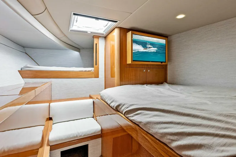  Yacht Photos Pics Interior cabin of 2020 Calcutta 480 Catamaran with bed, seating, and TV.