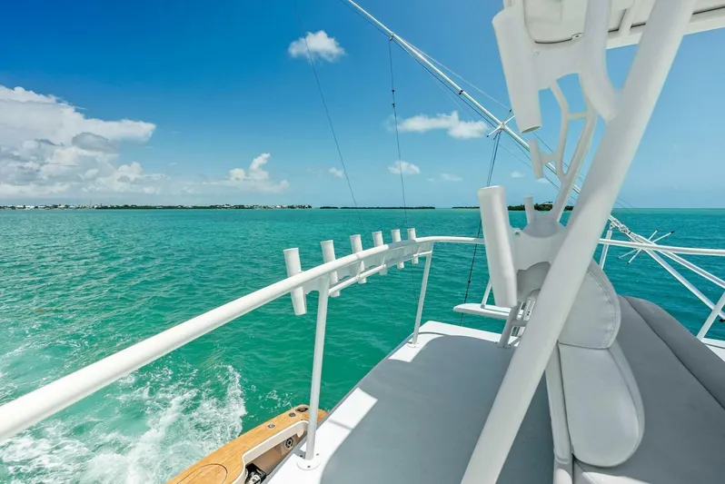  Yacht Photos Pics 2020 Calcutta 480 Catamaran cruising on turquoise waters under a clear blue sky.