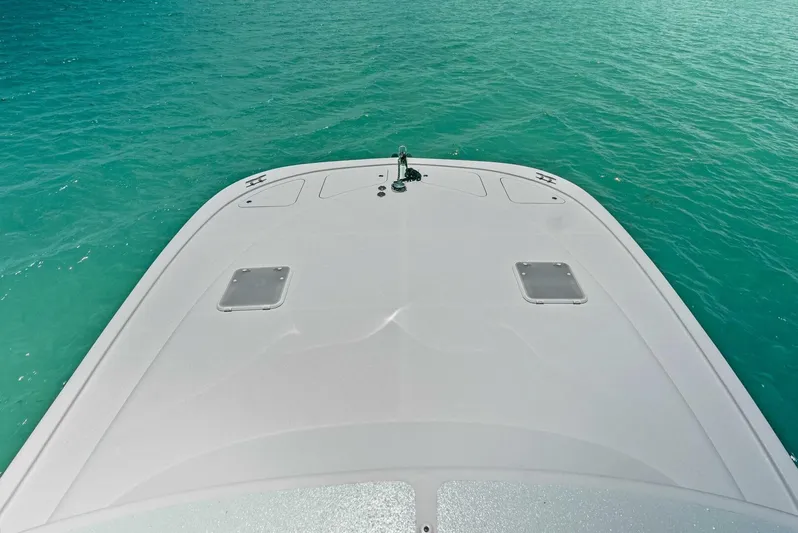  Yacht Photos Pics Bow of 2020 Calcutta 480 Catamaran on turquoise water.