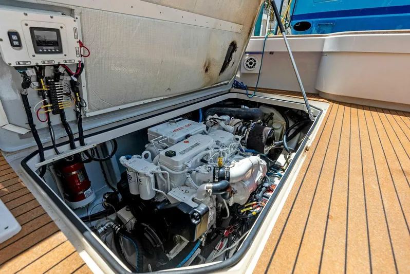  Yacht Photos Pics Engine compartment of a 2020 Calcutta 480 Catamaran with visible machinery and wiring.