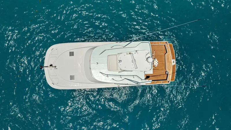  Yacht Photos Pics Aerial view of 2020 Calcutta 480 Catamaran on blue ocean water.