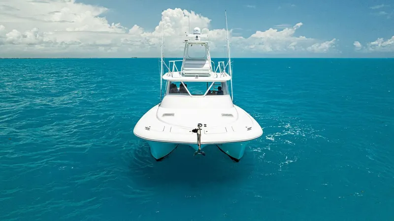  Yacht Photos Pics 2020 Calcutta 480 Catamaran on clear blue ocean water.