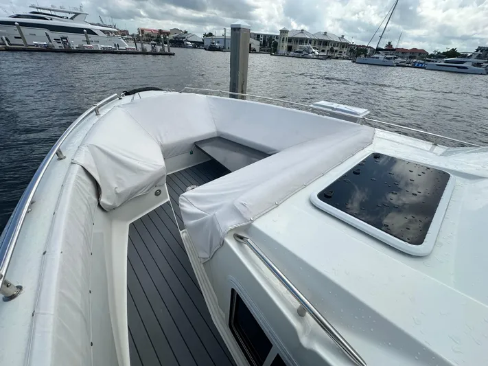  Yacht Photos Pics 2021 Formula 400 Super Sport Crossover yacht with spacious deck seating, docked at marina.