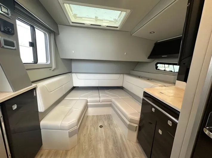  Yacht Photos Pics 2021 Formula 400 Super Sport Crossover interior with modern seating and skylight.