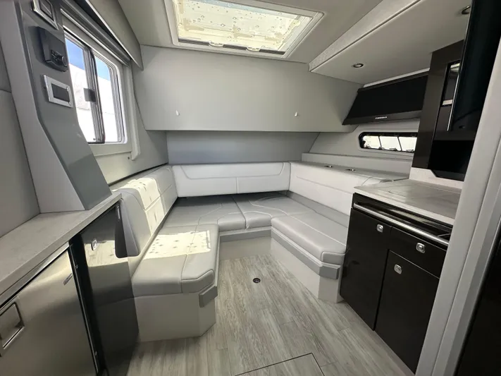  Yacht Photos Pics Luxurious interior of 2021 Formula 400 Super Sport Crossover yacht with modern seating and cabinetry.