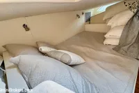 Luxurious cabin interior of 2023 Intrepid 41 Valor yacht with plush bedding.