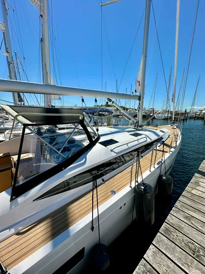 Hard Loaded Yacht Photos Pics 2024 Elan Impression 43 yacht docked at marina under clear blue sky.