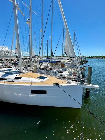 Hard Loaded Yacht Photos Pics 2024 Elan Impression 43 sailboat docked in sunny marina.