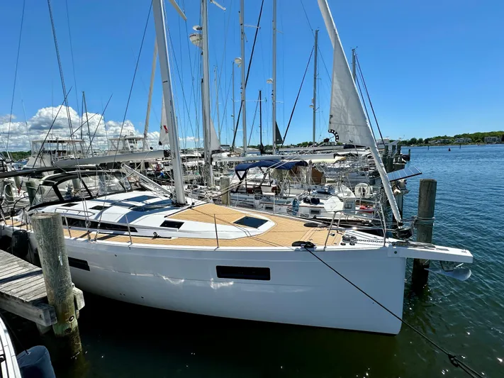 Hard Loaded Yacht Photos Pics 2024 Elan Impression 43 sailboat docked in a sunny marina.
