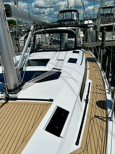 Hard Loaded Yacht Photos Pics 2024 Elan Impression 43 sailboat docked, showcasing sleek deck design and modern features.
