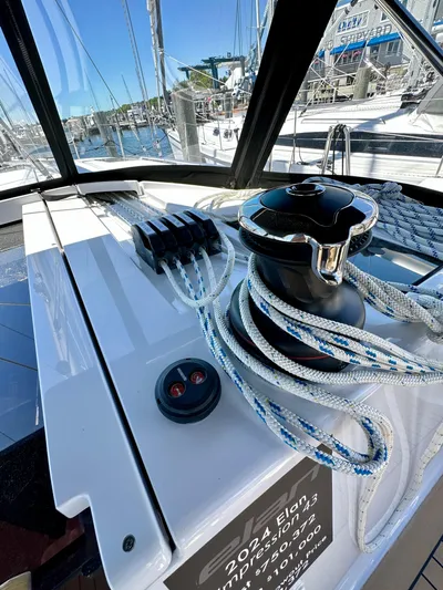 Hard Loaded Yacht Photos Pics 2024 Elan Impression 43 sailboat deck with winch and ropes in marina.