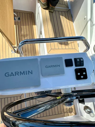 Hard Loaded Yacht Photos Pics 2024 Elan Impression 43 yacht helm with Garmin navigation system and teak decking.