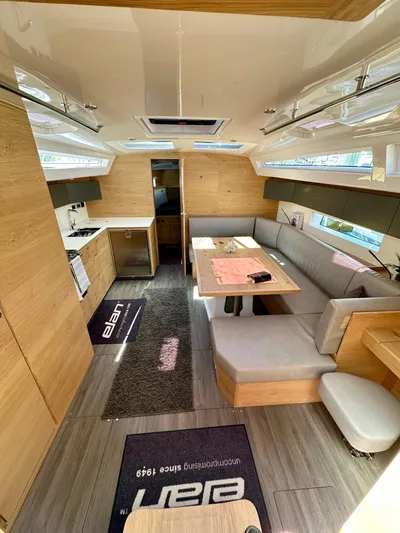 Hard Loaded Yacht Photos Pics 2024 Elan Impression 43 yacht interior with modern kitchen and cozy seating area.