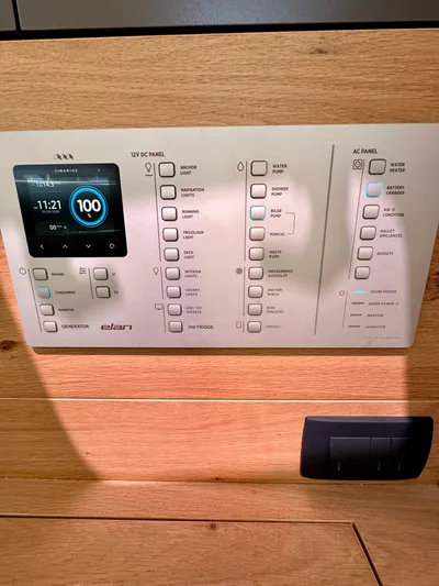 Hard Loaded Yacht Photos Pics Control panel of 2024 Elan Impression 43 yacht, featuring digital display and switches.