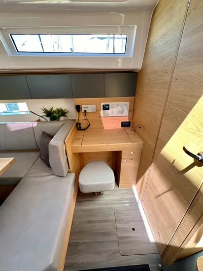 Hard Loaded Yacht Photos Pics 2024 Elan Impression 43 yacht interior with modern seating and workspace.