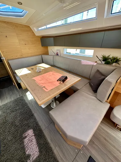 Hard Loaded Yacht Photos Pics 2024 Elan Impression 43 yacht interior with modern seating and natural light.