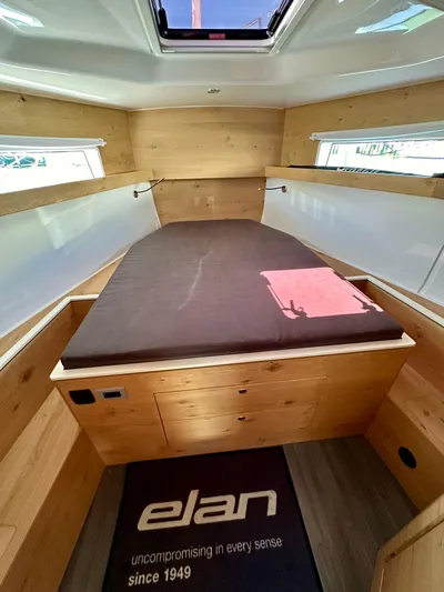 Hard Loaded Yacht Photos Pics 2024 Elan Impression 43 cabin interior with wooden finish and skylight.