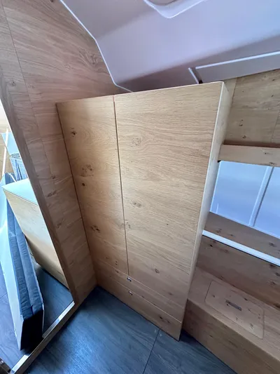 Hard Loaded Yacht Photos Pics 2024 Elan Impression 43 interior with wooden cabinetry and modern design.