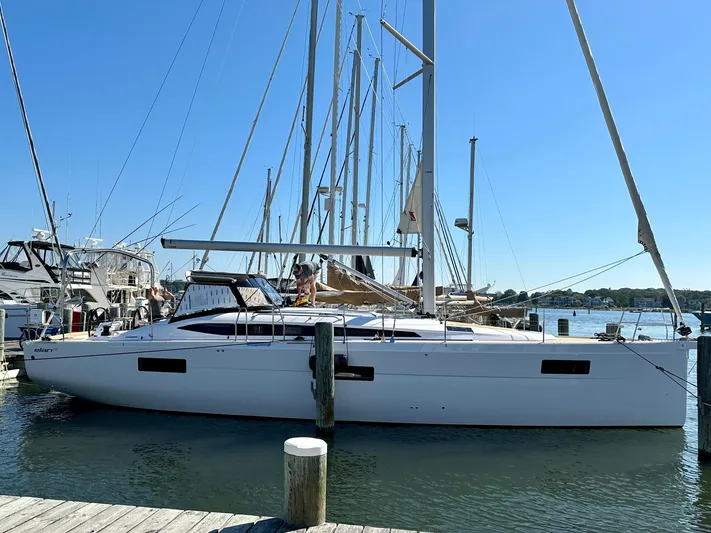 Hard Loaded Yacht Photos Pics 2024 Elan Impression 43 sailboat docked at a marina.