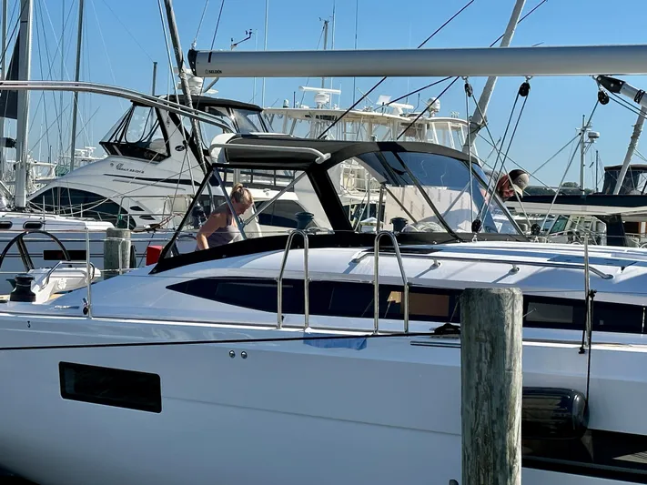 Hard Loaded Yacht Photos Pics 2024 Elan Impression 43 yacht docked at marina with people onboard.