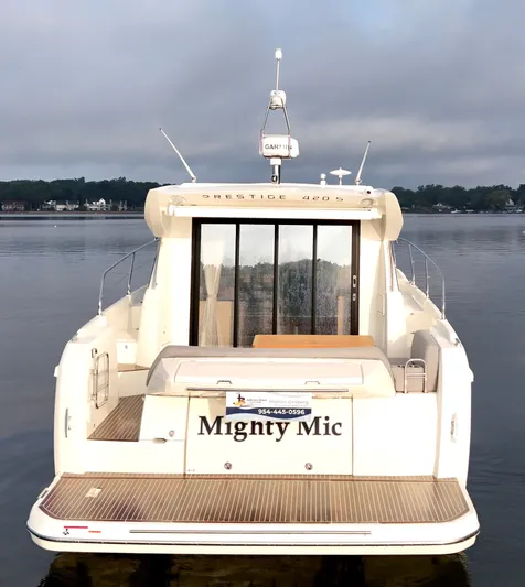 Mighty Mic Yacht Photos Pics 2024 Prestige 420S yacht named "Mighty Mic" on calm water.
