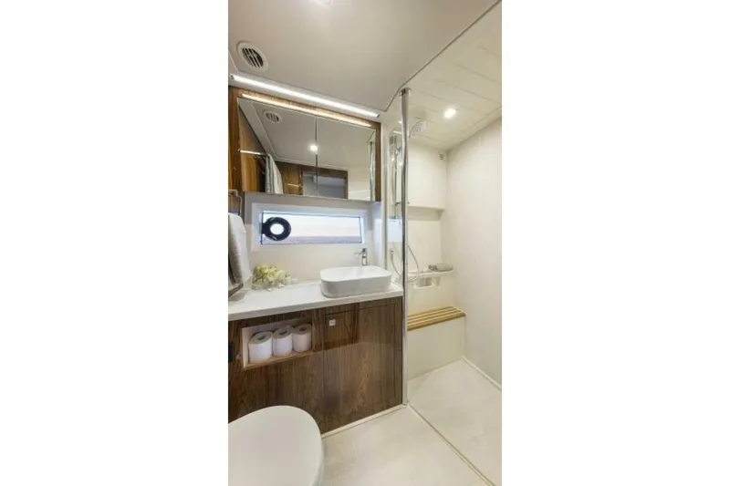  Yacht Photos Pics Luxurious bathroom in 2026 Riviera 4600 Sport Yacht Platinum Edition, featuring modern fixtures and elegant design.