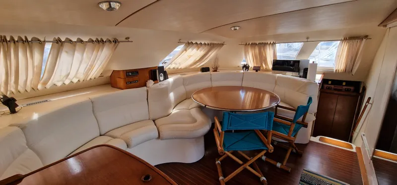 Lambada Yacht Photos Pics Luxurious interior of a 1993 Lagoon 47 yacht with elegant seating and dining area.