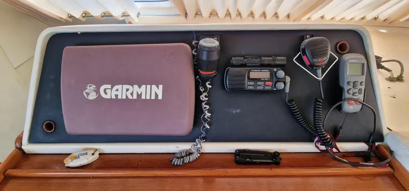 Lambada Yacht Photos Pics Navigation equipment on a 1993 Lagoon 47, featuring Garmin and Standard Horizon devices.