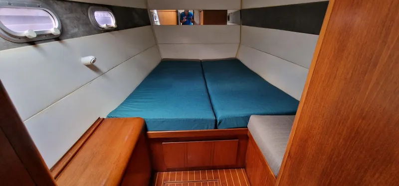 Lambada Yacht Photos Pics Interior cabin of a 1993 Lagoon 47 yacht with a cozy bed setup.