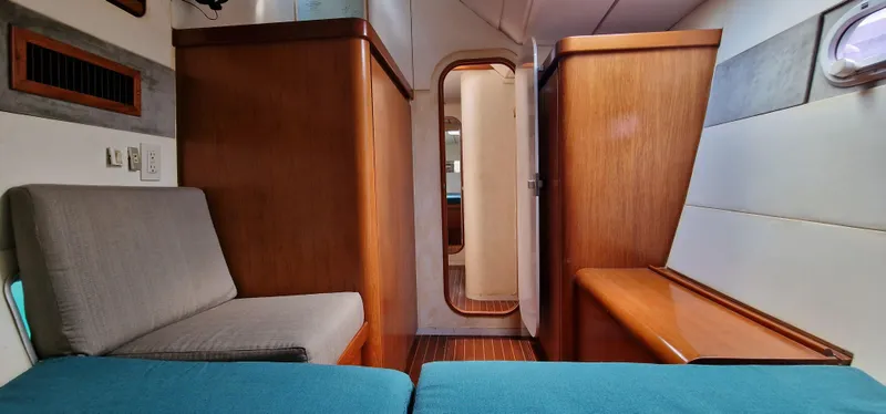 Lambada Yacht Photos Pics Interior of a 1993 Lagoon 47 yacht with wooden cabinetry and seating.