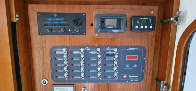 Lambada Yacht Photos Pics Control panel of a 1993 Lagoon 47 yacht with navigation and electronic systems.