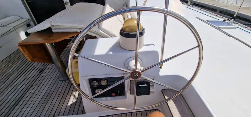 Lambada Yacht Photos Pics Steering wheel of 1993 Lagoon 47 yacht with navigation instruments on deck.