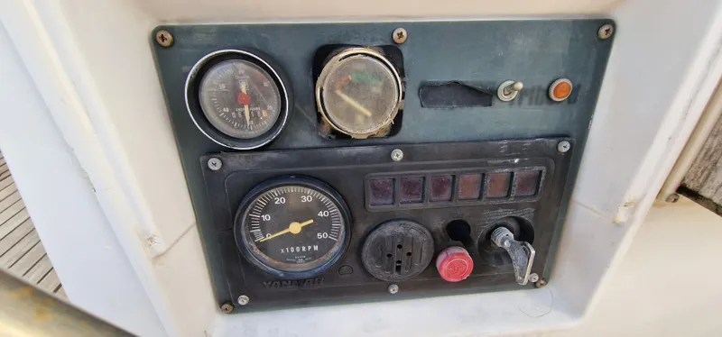 Lambada Yacht Photos Pics Control panel of a 1993 Lagoon 47 yacht with gauges and switches.