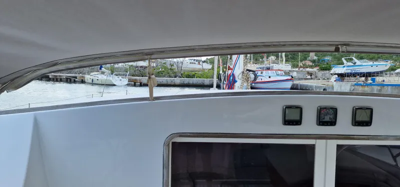 Lambada Yacht Photos Pics View from a 1993 Lagoon 47 yacht cockpit, overlooking a marina with docked boats.