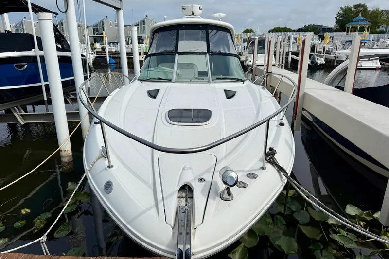 Flip Side Yacht Photos Pics 2010 Sea Ray 330 Sundancer docked at marina, front view.