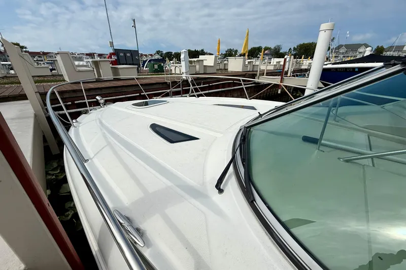 Flip Side Yacht Photos Pics 2010 Sea Ray 330 Sundancer docked at marina under cloudy sky.