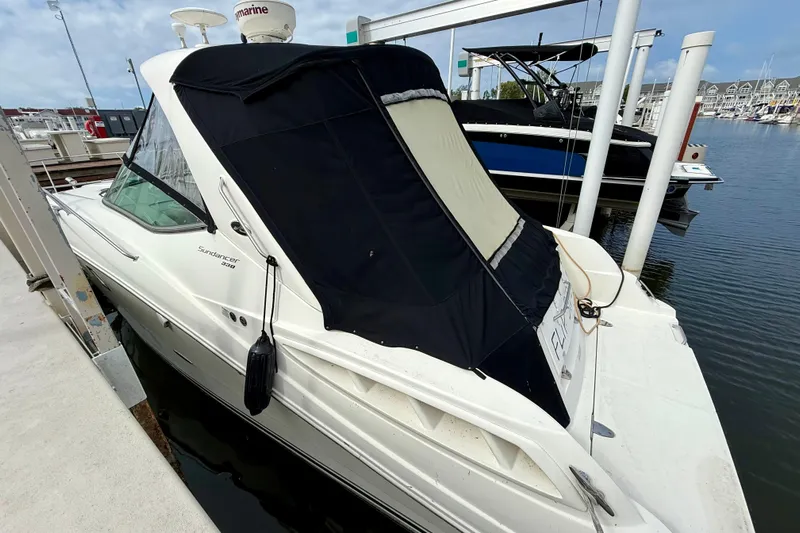 Flip Side Yacht Photos Pics 2010 Sea Ray 330 Sundancer docked at marina with black canopy.