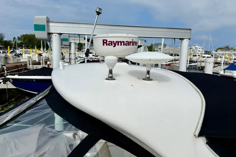 Flip Side Yacht Photos Pics Radar equipment on 2010 Sea Ray 330 Sundancer boat docked at marina.